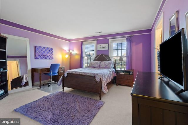 carpeted bedroom featuring ornamental molding