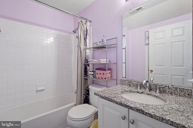 full bathroom featuring vanity, toilet, and shower / tub combo