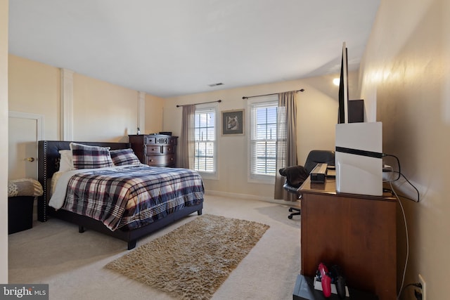 bedroom featuring light carpet and vaulted ceiling