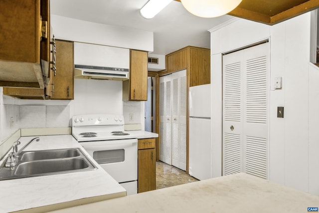 kitchen with white appliances and sink