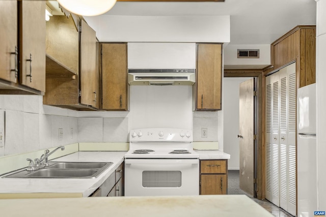 kitchen with sink and white appliances