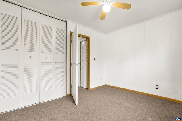 unfurnished bedroom with carpet, a closet, and ceiling fan