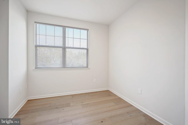 spare room featuring light hardwood / wood-style flooring