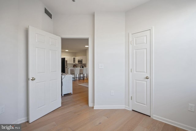 unfurnished bedroom featuring light hardwood / wood-style floors