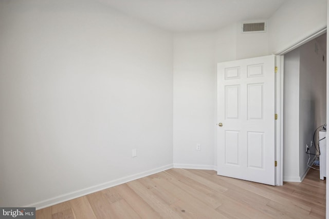 unfurnished room featuring light hardwood / wood-style floors