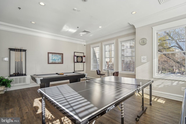 rec room with crown molding, dark wood-type flooring, and a healthy amount of sunlight