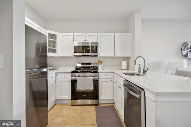 kitchen featuring white cabinetry, sink, and appliances with stainless steel finishes