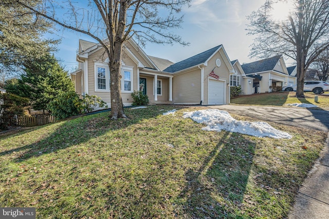 view of front facade featuring a garage and a front lawn