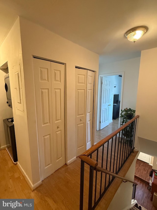 corridor with wood-type flooring