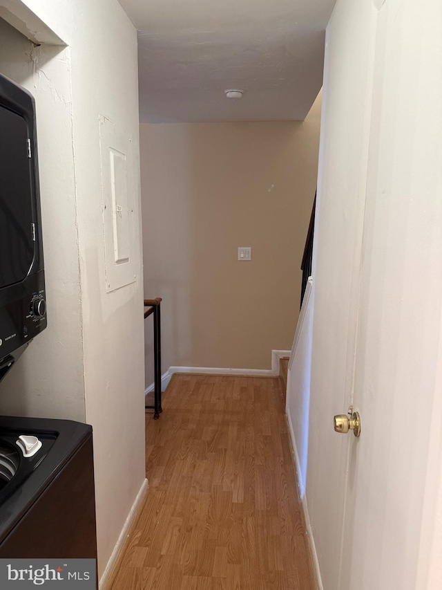 hall featuring electric panel and light wood-type flooring