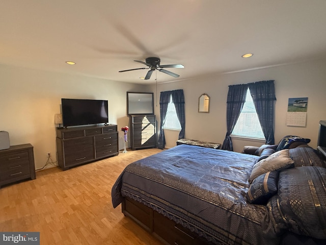 bedroom featuring light hardwood / wood-style floors and ceiling fan