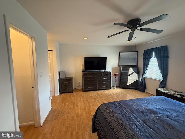 bedroom featuring ceiling fan and light hardwood / wood-style floors