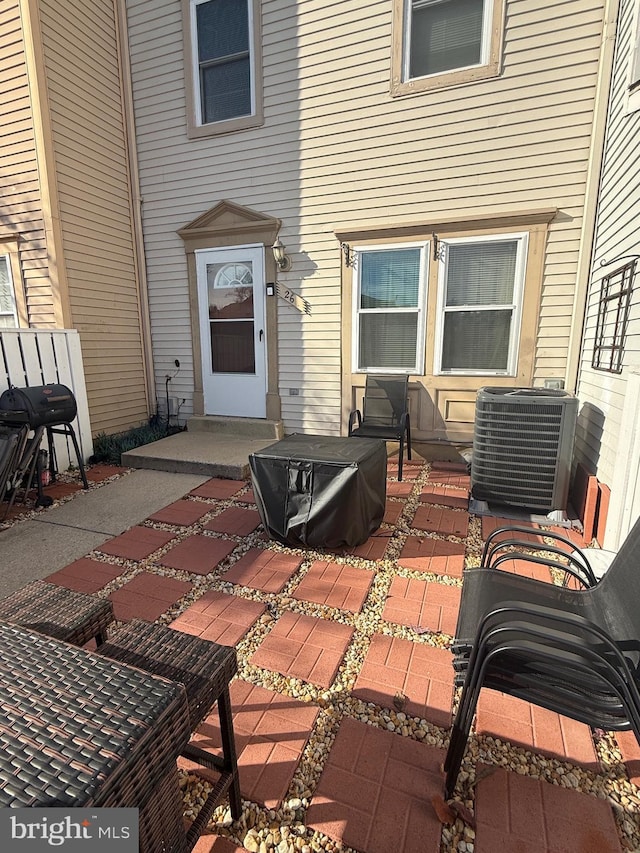 view of patio / terrace featuring central AC unit and grilling area