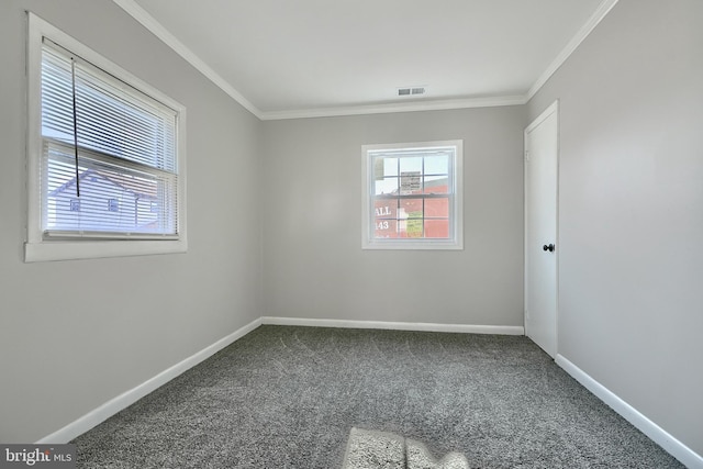 spare room with carpet flooring and ornamental molding