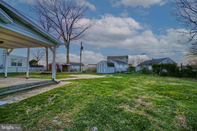 view of yard with a storage unit