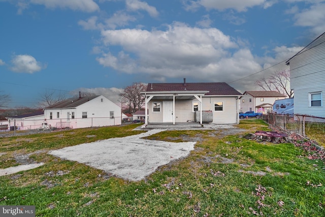 back of house featuring a yard and a patio