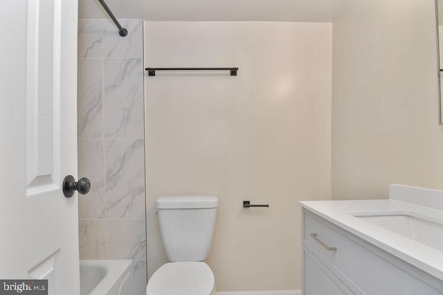 full bathroom featuring vanity, toilet, and tiled shower / bath