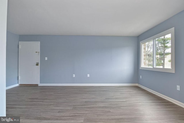 empty room with wood-type flooring