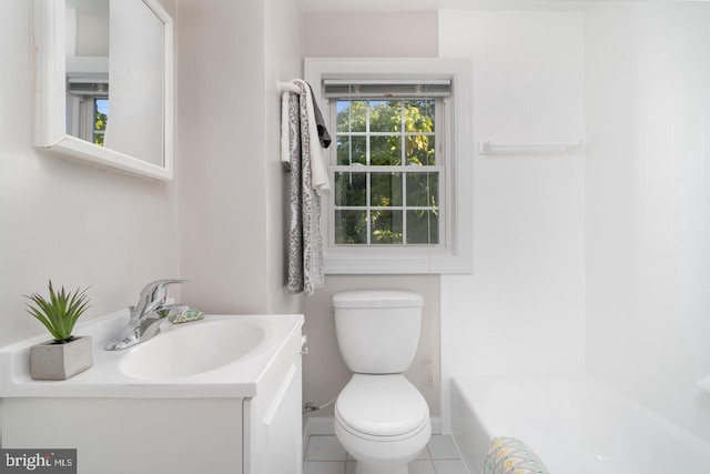 bathroom with tile patterned flooring, vanity, and toilet