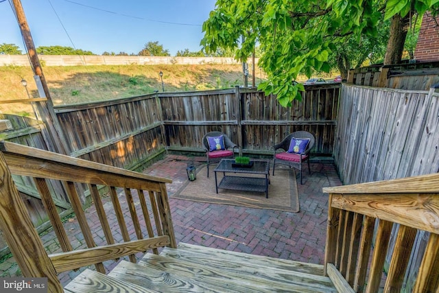 wooden deck with a patio area