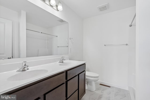 bathroom with vanity, toilet, and walk in shower