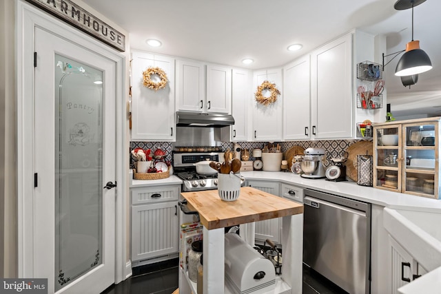 kitchen with white cabinetry, dishwasher, and hanging light fixtures