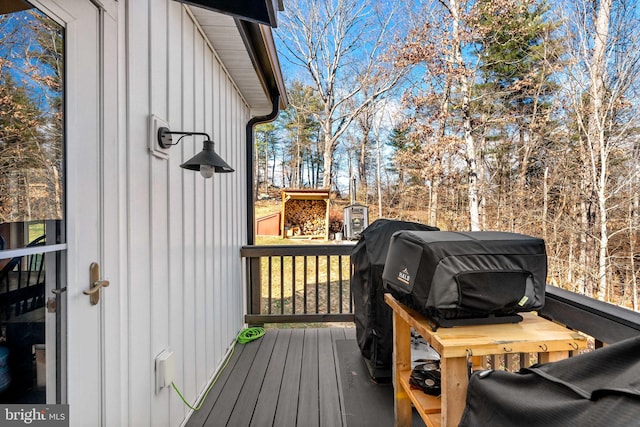 wooden deck featuring grilling area