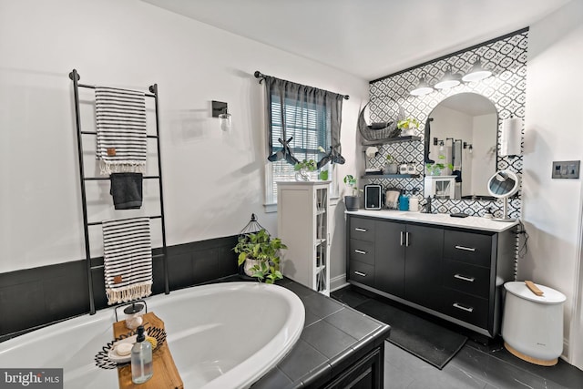 bathroom featuring vanity and a tub