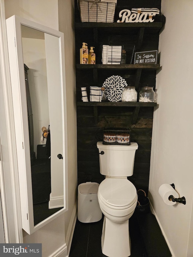 bathroom with tile patterned flooring and toilet