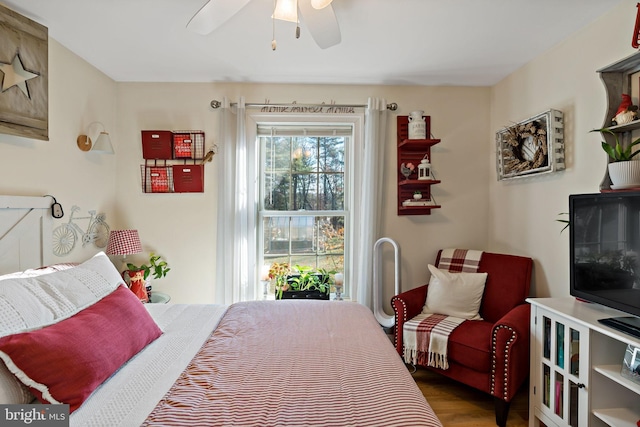 bedroom featuring hardwood / wood-style floors and ceiling fan