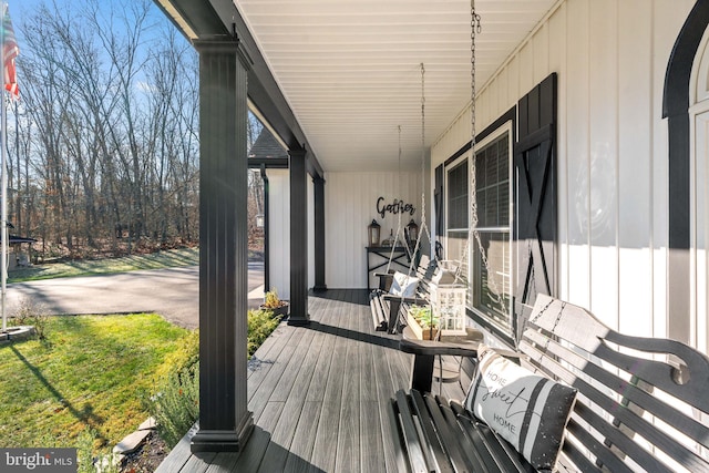 wooden terrace with a porch