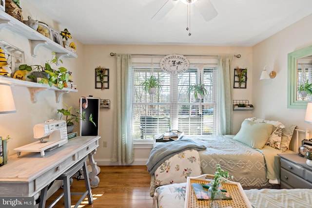 bedroom featuring ceiling fan and hardwood / wood-style flooring