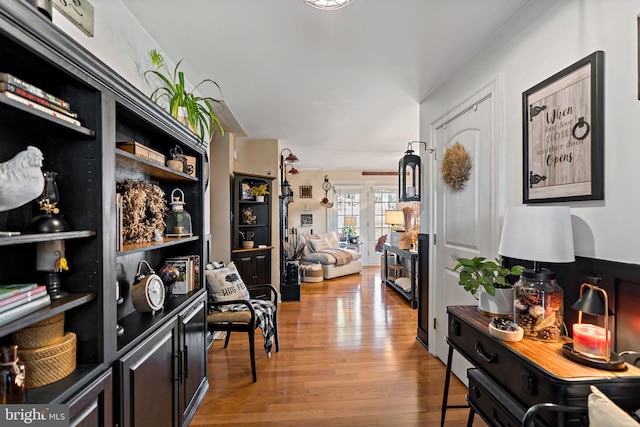 hallway with light hardwood / wood-style flooring