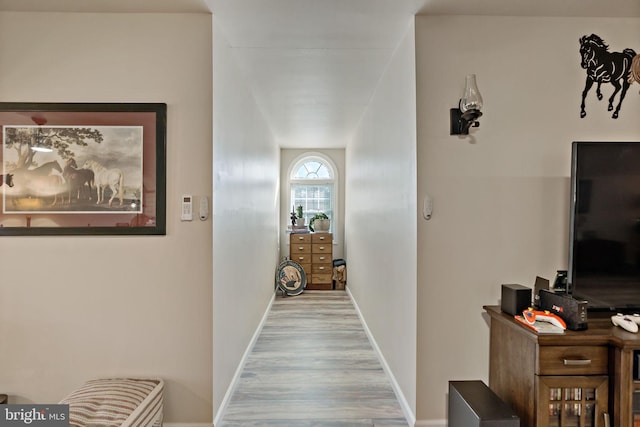 hall with light wood-type flooring