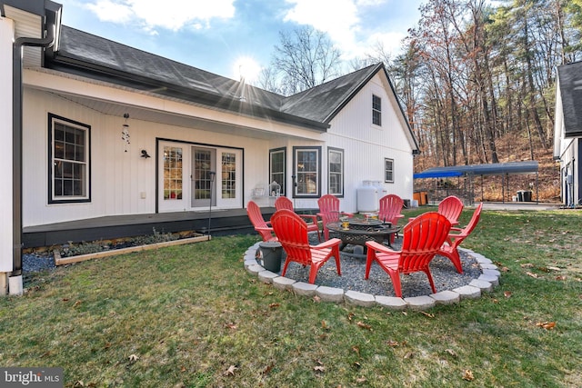 exterior space featuring a yard and an outdoor fire pit