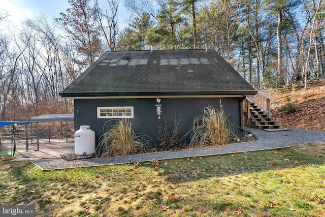 view of side of home featuring a lawn