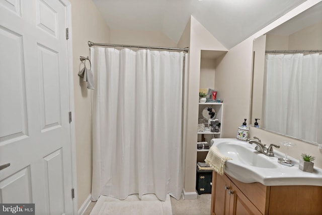 bathroom with tile patterned floors and vanity