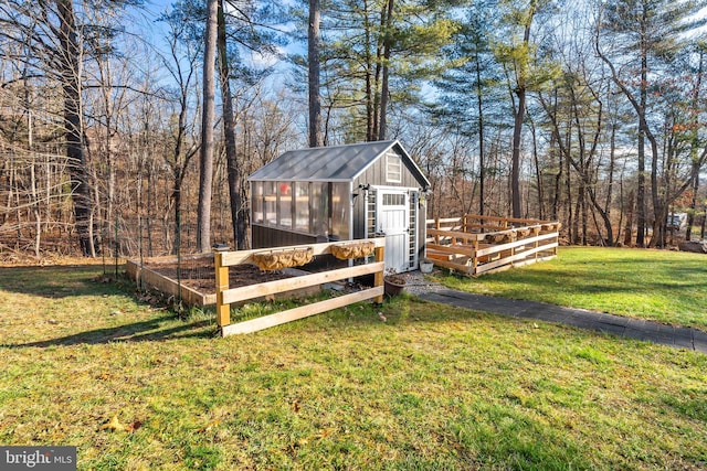 view of outbuilding featuring a yard