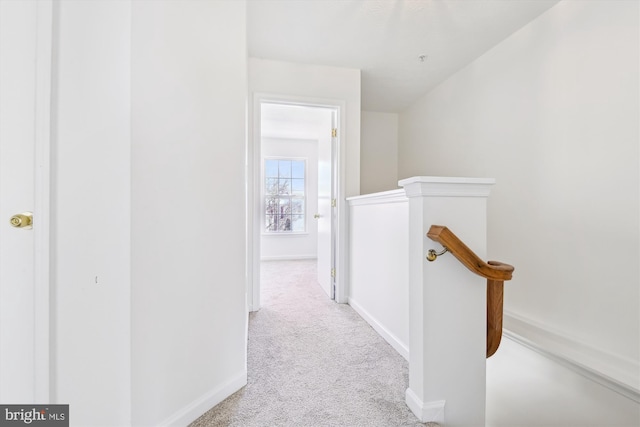 hallway with light carpet