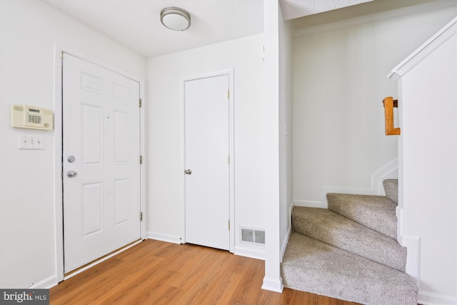 entrance foyer featuring light hardwood / wood-style floors