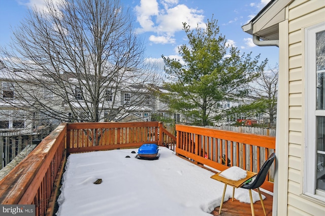 view of snow covered deck