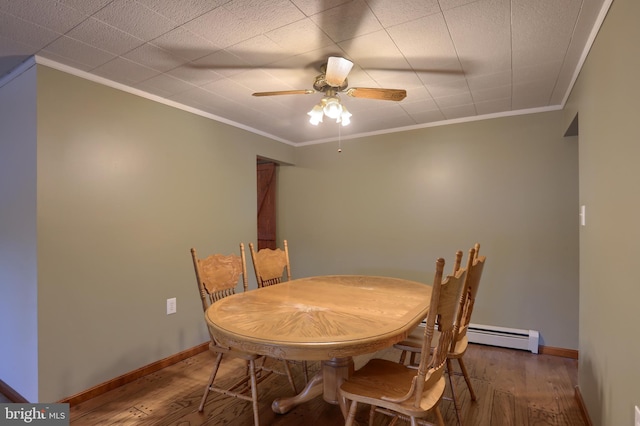 dining space with crown molding, hardwood / wood-style floors, and ceiling fan