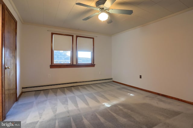 carpeted empty room with baseboard heating, crown molding, and ceiling fan