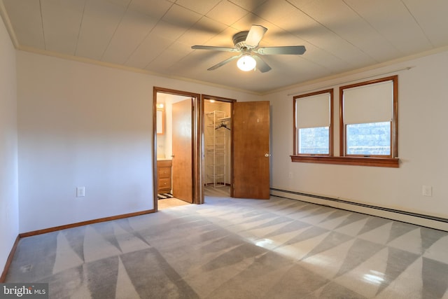 unfurnished bedroom featuring light carpet, ceiling fan, a spacious closet, connected bathroom, and a closet