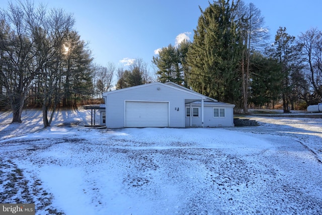 view of snow covered garage