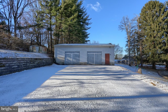 view of snow covered garage