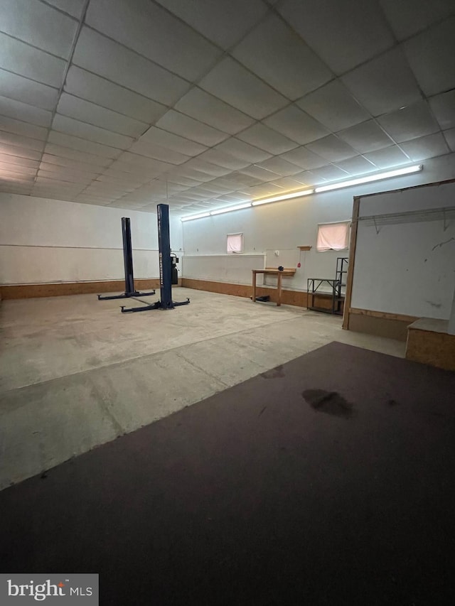 basement featuring a paneled ceiling