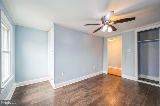 unfurnished bedroom featuring ceiling fan, dark hardwood / wood-style flooring, and ornamental molding