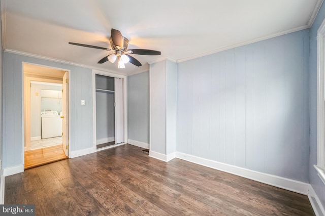 unfurnished bedroom with washer / clothes dryer, ceiling fan, dark hardwood / wood-style floors, and ornamental molding