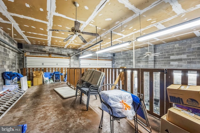 interior space with concrete floors and ceiling fan